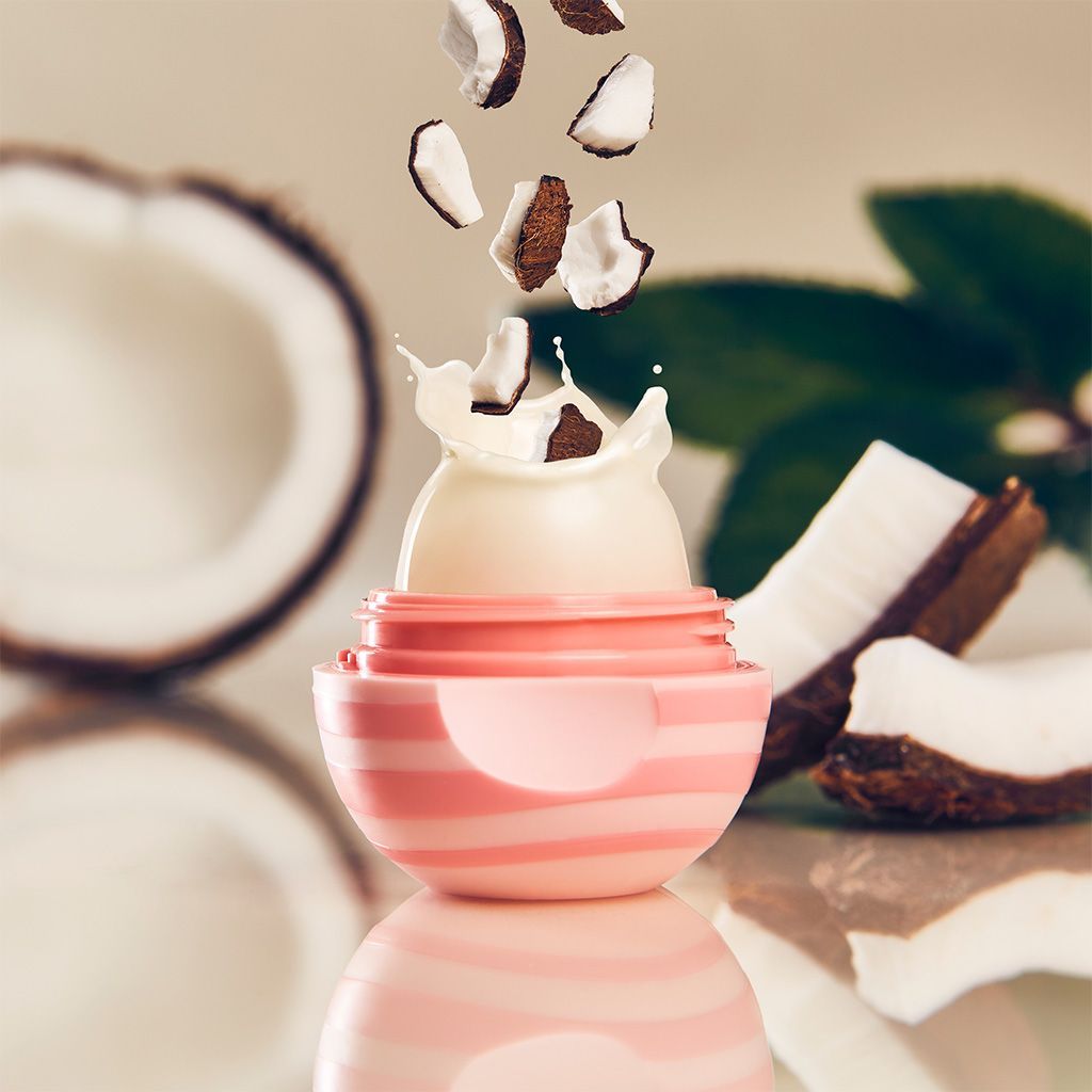 Photo illustration of open eos lip balm container showing coconut flavor